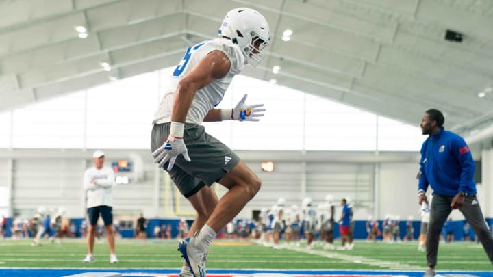 Kansas redshirt junior defensive end Dean Miller (45) works through a drill during an indoor practice Wednesday, July 31.