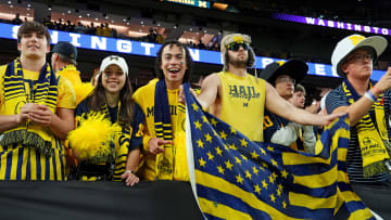Jan 8, 2024; Houston, TX, USA; Michigan Wolverines fans cheers before the 2024 College Football Playoff national championship game between the Michigan Wolverines and the Washington Huskies at NRG Stadium. Mandatory Credit: Kirby Lee-USA TODAY Sports