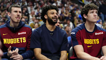 Apr 6, 2025; Denver, Colorado, USA; Denver Nuggets forward Vlatko Cancar (31), guard Jamal Murray (27) and center PJ Hall (13) on the bench during the fourth quarter against the Indiana Pacers at Ball Arena.