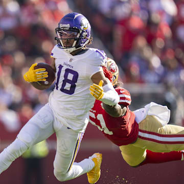 November 28, 2021; Santa Clara, California, USA; Minnesota Vikings wide receiver Justin Jefferson (18) runs against San Francisco 49ers outside linebacker Azeez Al-Shaair (51) during the second quarter at Levi's Stadium. Mandatory Credit: Kyle Terada-Imagn Images