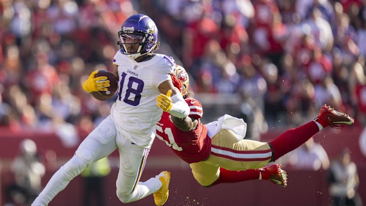 November 28, 2021; Santa Clara, California, USA; Minnesota Vikings wide receiver Justin Jefferson (18) runs against San Francisco 49ers outside linebacker Azeez Al-Shaair (51) during the second quarter at Levi's Stadium. Mandatory Credit: Kyle Terada-Imagn Images