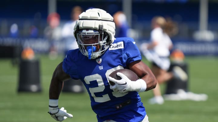 Jul 26, 2024; East Rutherford, NJ, USA; New York Giants running back Tyrone Tracy Jr. (29) carries a ball during training camp at Quest Diagnostics Training Center.  