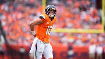 Oct 27, 2024; Denver, Colorado, USA; Denver Broncos quarterback Bo Nix (10) during the first half against the Carolina Panthers at Empower Field at Mile High. Mandatory Credit: Ron Chenoy-Imagn Images