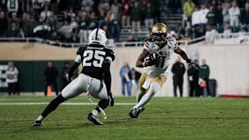 Sep 6, 2025; East Lansing, Michigan, USA; Boston College wide receiver Lewis Bond (11) runs with the ball after a catch in overtime at Spartan Stadium. Mandatory Credit: Brendan Mullin-Imagn Images
