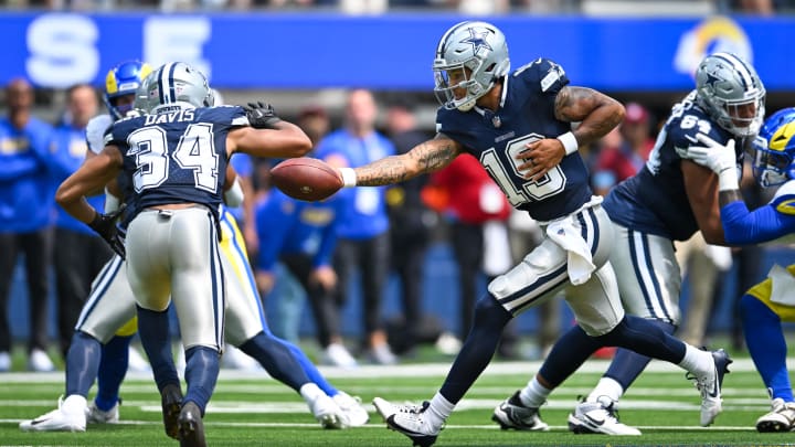 Dallas Cowboys quarterback Trey Lance (19) passes the ball to running back Malik Davis (34)