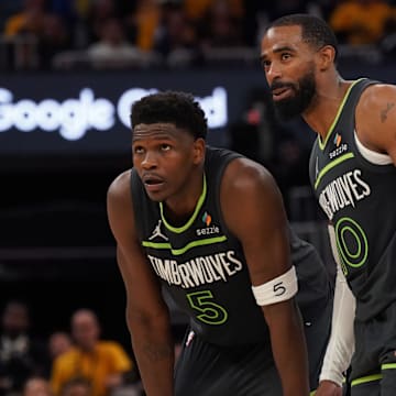 May 10, 2025; San Francisco, California, USA; Minnesota Timberwolves guard Anthony Edwards (5) and guard Mike Conley (10) wait for play to resume against the Golden State Warriors in the fourth quarter during game three in the second round for the 2025 NBA Playoffs at Chase Center.