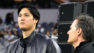 Los Angeles Dodgers player Shohei Ohtani (left) and agent Nez Balelo attend the game between the Los Angeles Rams and the New Orleans Saints at SoFi Stadium on Dec. 21, 2023.
