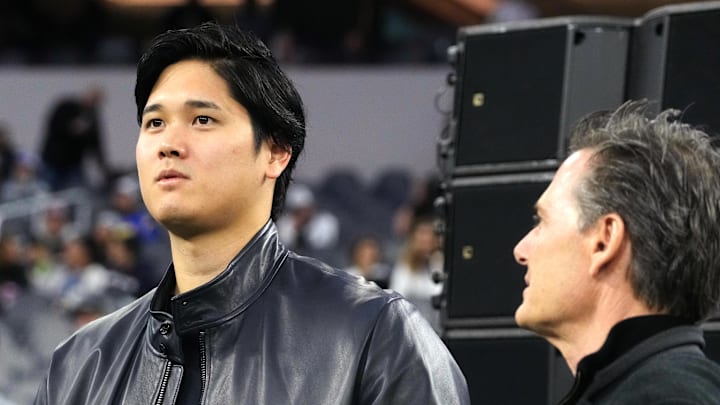 Los Angeles Dodgers player Shohei Ohtani (left) and agent Nez Balelo attend the game between the Los Angeles Rams and the New Orleans Saints at SoFi Stadium on Dec. 21, 2023.