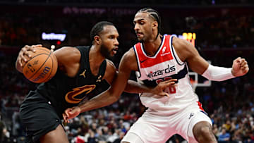 Dec 3, 2024; Cleveland, Ohio, USA; Cleveland Cavaliers forward Evan Mobley (4) drives to the basket against Washington Wizards forward Alexandre Sarr (20) during the second half at Rocket Mortgage FieldHouse. Mandatory Credit: Ken Blaze-Imagn Images