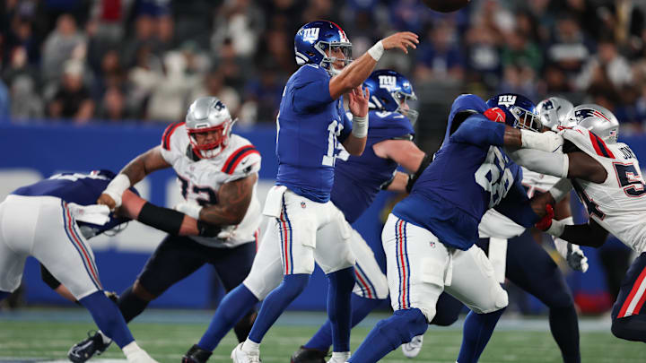 New York Giants quarterback Tommy DeVito (15) throws a pass during the second half against the New England Patriots