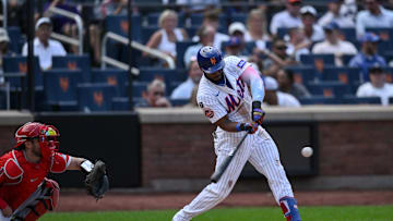 Jul 23, 2025; New York City, New York, USA; New York Mets outfielder Starling Marte (6) hits a double against the Los Angeles Angels during the fifth inning at Citi Field. Mandatory Credit: John Jones-Imagn Images