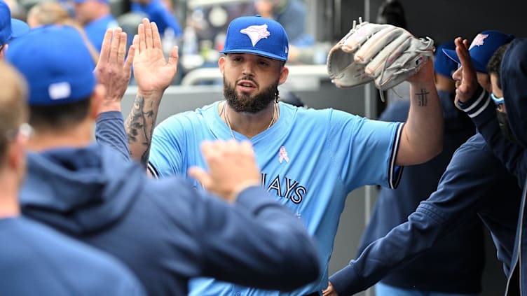 May 12, 2024; Toronto, Ontario, CAN;  Toronto Blue Jays pitcher Alek Manoah (6) is greeted by team