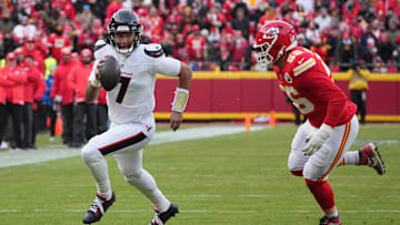 Jan 18, 2025; Kansas City, Missouri, USA; Houston Texans quarterback C.J. Stroud (7) rolls out to throw against Kansas City Chiefs defensive end George Karlaftis (56) during the first quarter of a 2025 AFC divisional round game at GEHA Field at Arrowhead Stadium. Mandatory Credit: Denny Medley-Imagn Images