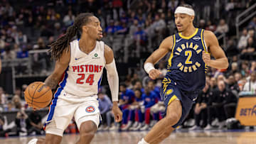 Nov 17, 2025; Detroit, Michigan, USA; Detroit Pistons guard Daniss Jenkins (24) moves the ball up court next to Indiana Pacers guard Andrew Nembhard (2) during the first quarter at Little Caesars Arena. Mandatory Credit: David Reginek-Imagn Images