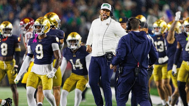 Notre Dame head coach Marcus Freeman celebrates after stopping USC on a fourth down 