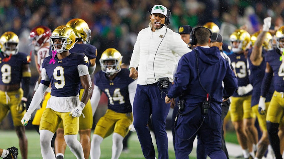 Notre Dame head coach Marcus Freeman celebrates after stopping USC on a fourth down