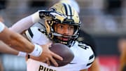 Purdue Boilermakers running back Devin Mockobee (45) takes a handoff 