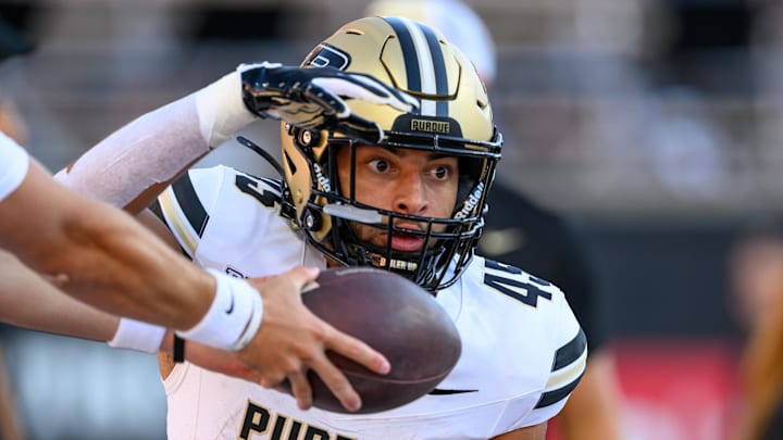Purdue Boilermakers running back Devin Mockobee (45) takes a handoff Purdue Boilermakers running back Devin Mockobee (45) takes a handoff