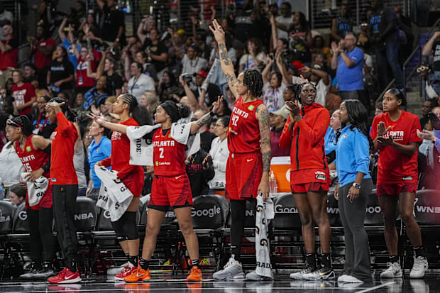 Atlanta Dream players react on the bench. 