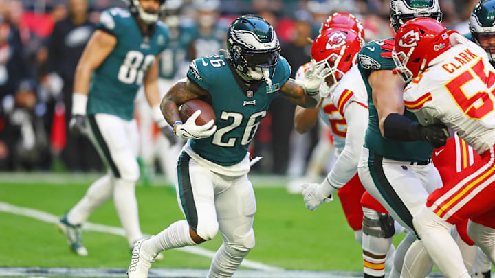 Feb 12, 2023; Glendale, Arizona, US; Philadelphia Eagles running back Miles Sanders (26) runs with the ball against the Kansas City Chiefs during the first quarter of Super Bowl LVII at State Farm Stadium. Mandatory Credit: Mark J. Rebilas-Imagn Images