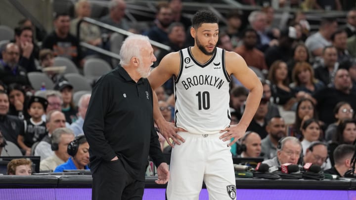 Jan 17, 2023; San Antonio, Texas, USA;  San Antonio Spurs head coach Gregg Popovich speaks with Brooklyn Nets guard Ben Simmons (10) in the first half at the AT&T Center. Mandatory Credit: Daniel Dunn-USA TODAY Sports