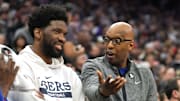 Jan 21, 2023; Sacramento, California, USA; Philadelphia 76ers assistant coach Sam Cassell (right) talks to center Joel Embiid (left) during the second quarter against the Sacramento Kings at Golden 1 Center. Mandatory Credit: Darren Yamashita-Imagn Images
