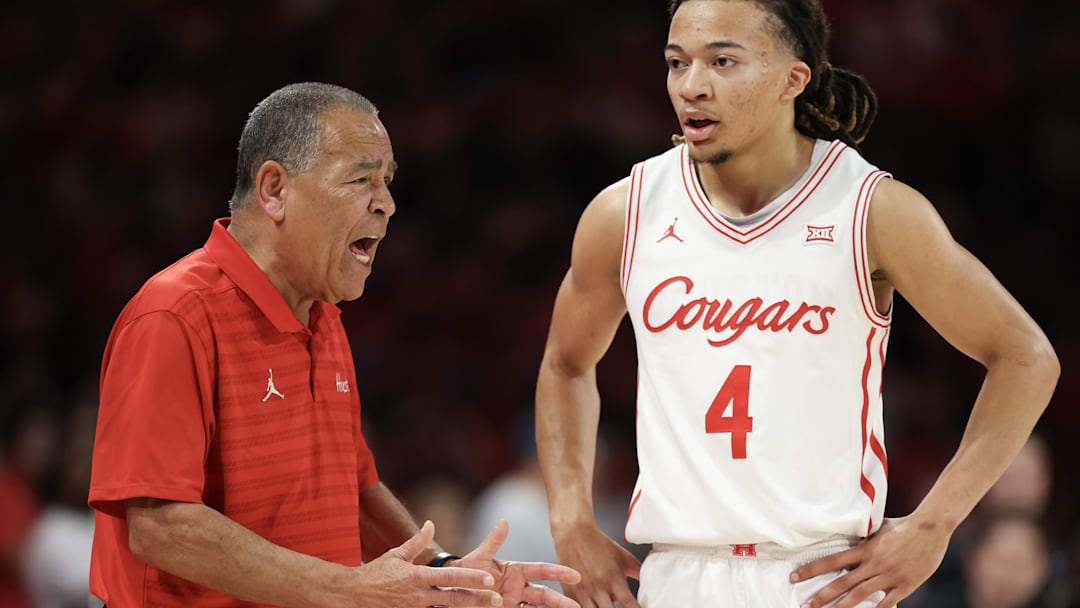 Feb 21, 2026; Houston, Texas, USA;  Houston Cougars head coach Kelvin Sampson talks with guard Kingston Flemings (4) while playing against the Arizona Wildcats in the first half at Fertitta Center. Mandatory Credit: Thomas Shea-Imagn Images