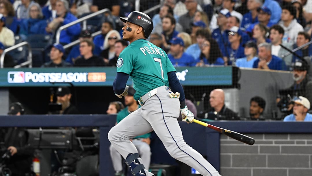 Oct 13, 2025; Toronto, Ontario, CAN; Seattle Mariners second baseman Jorge Polanco (7) hits a three run home run against the Toronto Blue Jays in the fifth inning during game two of the ALCS round for the 2025 MLB playoffs at Rogers Centre. Mandatory Credit: Dan Hamilton-Imagn Images