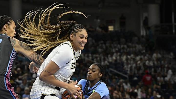 Jul 16, 2025; Chicago, Illinois, USA;  Chicago Sky center Kamilla Cardoso (10) fights for the ball against Atlanta Dream guard Maya Caldwell (33) during the first half at Wintrust Arena. Mandatory Credit: Matt Marton-Imagn Images