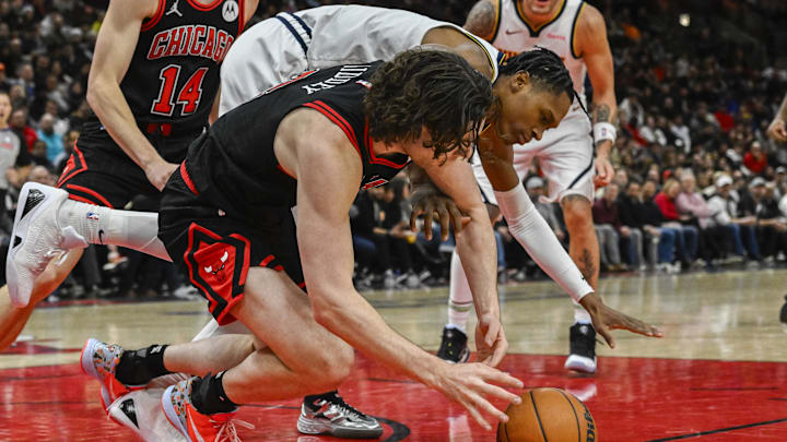 Jan 27, 2025; Chicago, Illinois, USA;  Chicago Bulls guard Josh Giddey (3) and Denver Nuggets forward Peyton Watson (8) chase the ball during the second half at the United Center. Mandatory Credit: Matt Marton-Imagn Images