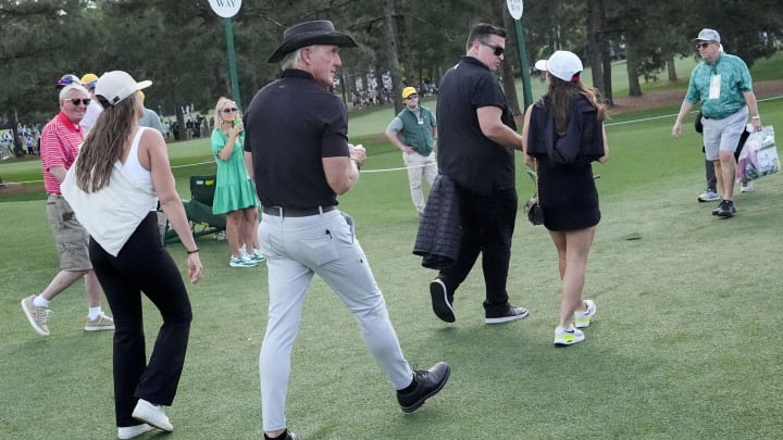 Apr 11, 2024; Augusta, Georgia, USA; Greg Norman walks behind the no. 2 hole during the first round of the Masters.