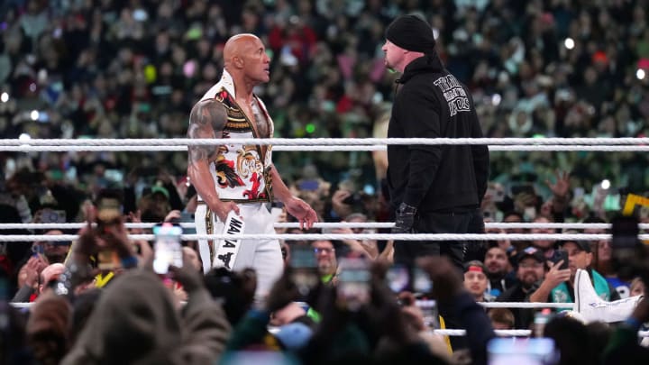 Apr 7, 2024; Philadelphia, PA, USA; The Rock and The Undertaker interfere in the WWE Universal Championship match between Roman Reigns and Cody Rhodes during WrestleMania XL Sunday at Lincoln Financial Field.