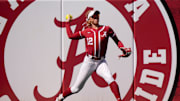 Mar 16, 2025; Tuscaloosa AL, USA; Alabama left fielder Audrey Vandagriff (12) throws to the infield after catching a fly ball near the fence in left. Mississippi State defeated Alabama 4-3 Sunday to claim the series two games to one.