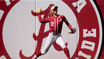 Mar 16, 2025; Tuscaloosa AL, USA; Alabama left fielder Audrey Vandagriff (12) throws to the infield after catching a fly ball near the fence in left. Mississippi State defeated Alabama 4-3 Sunday to claim the series two games to one.