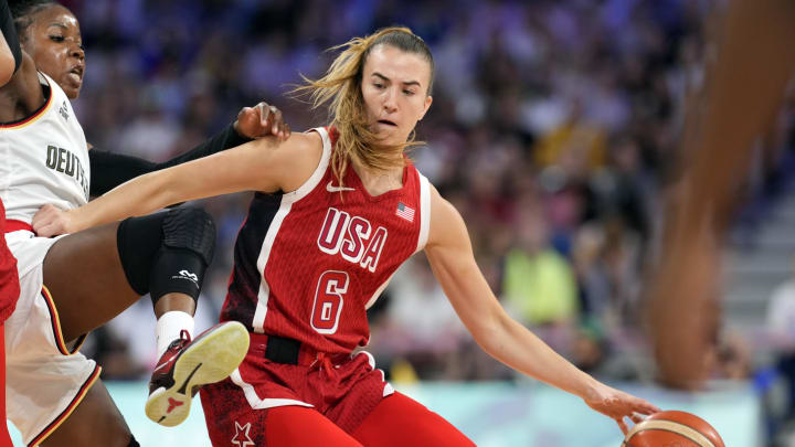 Aug 4, 2024; Villeneuve-d'Ascq, France; Germany point guard Alexis Peterson (1) defends against United States guard Sabrina Ionescu (6) in the first half in a women’s group C game during the Paris 2024 Olympic Summer Games at Stade Pierre-Mauroy. Mandatory Credit: John David Mercer-USA TODAY Sports