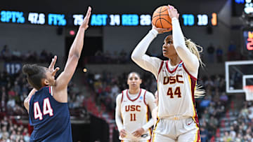Mar 31, 2025; Spokane, WA, USA; USC Trojans forward Kiki Iriafen (44) shoots against UConn Huskies forward Aubrey Griffin (44) during the second half of a Elite 8 NCAA Tournament basketball game at Spokane Arena. Mandatory Credit: James Snook-Imagn Images