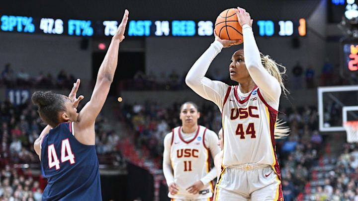 Mar 31, 2025; Spokane, WA, USA; USC Trojans forward Kiki Iriafen (44) shoots against UConn Huskies forward Aubrey Griffin (44) during the second half of a Elite 8 NCAA Tournament basketball game at Spokane Arena. Mandatory Credit: James Snook-Imagn Images