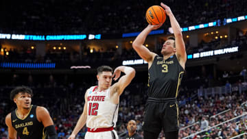 Mar 23, 2024; Pittsburgh, PA, USA; Oakland Golden Grizzlies guard Jack Gohlke (3) shoots the ball against North Carolina State Wolfpack guard Michael O'Connell (12) during the second half in the second round of the 2024 NCAA Tournament at PPG Paints Arena.