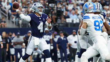 Dallas Cowboys quarterback Dak Prescott throws as Detroit Lions defensive end Aidan Hutchinson rushes.