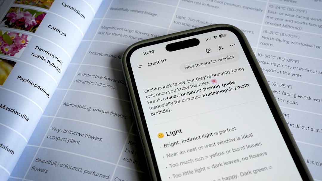 Photo of a phone asking ChatGPT a question over a book about orchids
