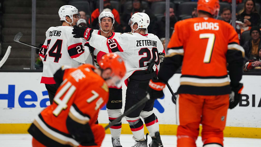 Nov 20, 2025; Anaheim, California, USA; Ottawa Senators center Dylan Cozens (24), defenseman Nick Jensen (3) and left wing Fabian Zetterlund (20) celebrate after a goal Anaheim Ducks in the first period at Honda Center. Mandatory Credit: Kirby Lee-Imagn Images