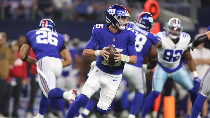 New York Giants quarterback Tommy DeVito rolls out in the fourth quarter against the Dallas Cowboys.