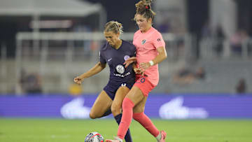 Racing Louisville FC midfielder Kayla Fischer (9) battles North Carolina Courage midfielder Riley Jackson (16) for the ball in the second half at Lynn Family Stadium 