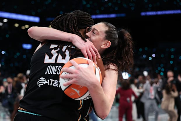 Jonquel Jones and Breanna Stewart hug moments after the New York Liberty when their first WNBA title. 