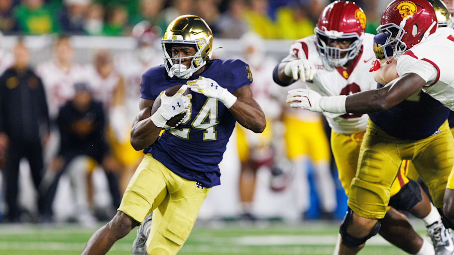Jadarian Price runs with the ball against USC.