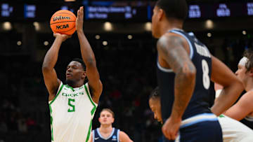 Mar 21, 2025; Seattle, WA, USA; Oregon Ducks guard TJ Bamba (5) shoots a free throw against the Liberty Flames during the second half in the first round of the NCAA Tournament at Climate Pledge Arena. Mandatory Credit: Steven Bisig-Imagn Images