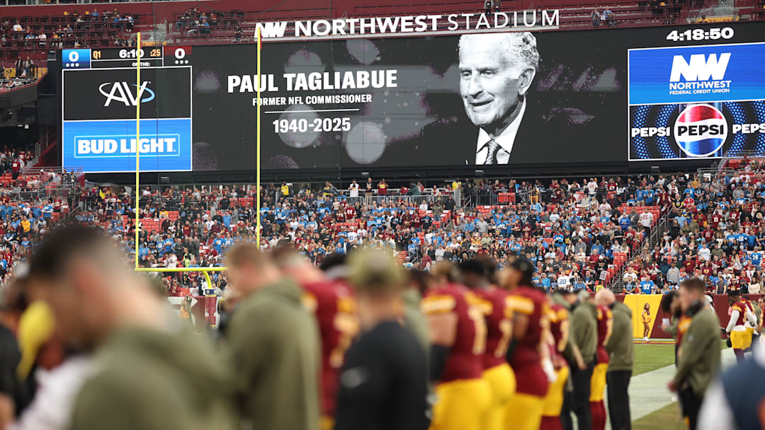 A tribute to former NFL commissioner Paul Tagliabue is seen on the video board prior to a game between the Washington Commanders and the Detroit Lions at Northwest Stadium on Sunday, Nov. 9, 2025. 