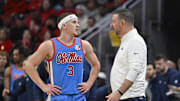 Dec 3, 2024; Louisville, Kentucky, USA;  Mississippi Rebels head coach Chris Beard talks with guard Sean Pedulla (3) during the second half against the Louisville Cardinals at KFC Yum! Center. Mandatory Credit: Jamie Rhodes-Imagn Images