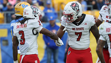 Oct 25, 2025; Pittsburgh, Pennsylvania, USA; North Carolina State Wolfpack tight end Justin Joly (7) celebrates with running back Hollywood Smothers (3) after scoring a touchdown against the Pittsburgh Panthers during the first quarter at Acrisure Stadium. Mandatory Credit: Charles LeClaire-Imagn Images