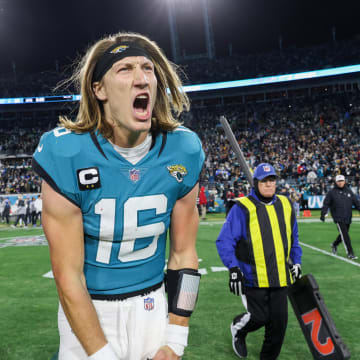Jan 14, 2023; Jacksonville, Florida, USA; Jacksonville Jaguars quarterback Trevor Lawrence (16) celebrates after beating the Los Angeles Chargers during a wild card game at TIAA Bank Field. Mandatory Credit: Nathan Ray Seebeck-USA TODAY Sports